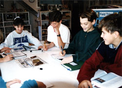 Journalism: Merit students discuss who will cover each event and and lay out a time line.